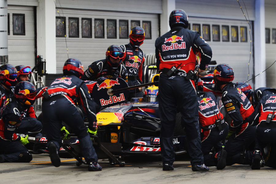 Mark Webber makes a pit stop for intermediate tyres