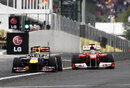 Mark Webber and Fernando Alonso fight for position heading towards the first corner