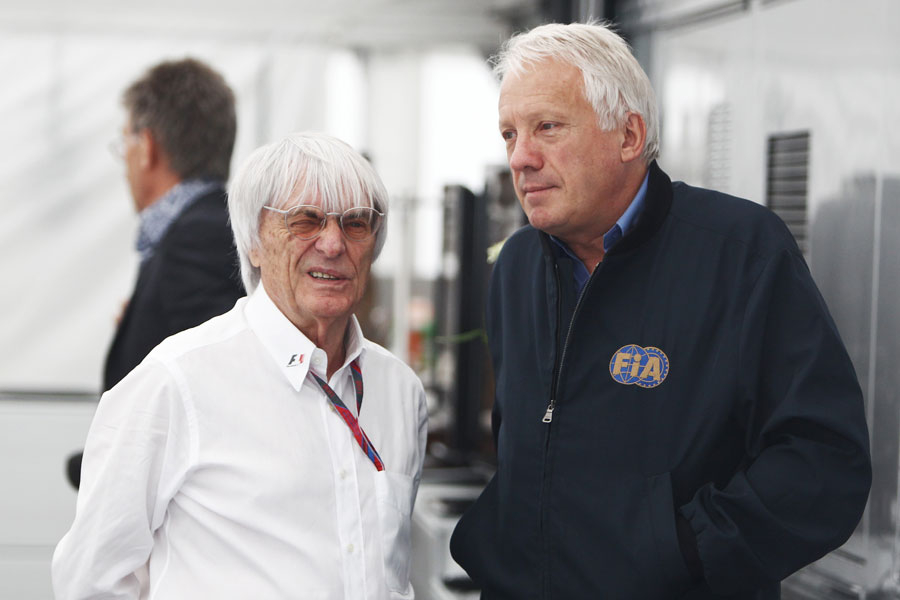 Bernie Ecclestone talks to FIA delegate Charlie Whiting in the paddock on Sunday morning