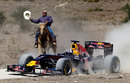 David Coulthard drives the Red Bull show car while being chased by a cowboy at a ranch in Texas