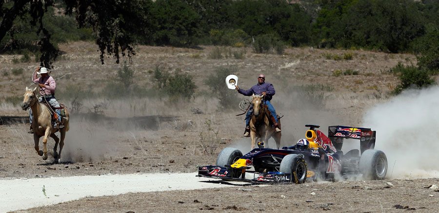 David Coulthard drives the Red Bull show car while being chased by cowboys at a ranch in Texas