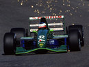 Sparks fly from the rear of Michael Schumacher's Jordan