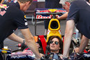 Tom Cruise receives advice from David Coulthard before going out in the Red Bull