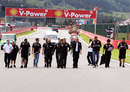 The Renault team walks the track with drivers Bruno Senna and Vitaly Petrov