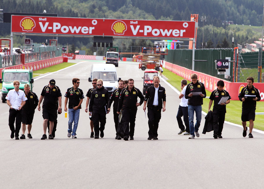 The Renault team walks the track with drivers Bruno Senna and Vitaly Petrov