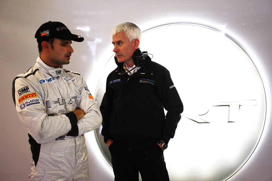 Tonio Liuzzi talks to Geoff Willis in the HRT garage