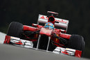 Fernando Alonso on a damp track at Spa