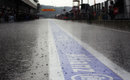 A soaking wet pit lane during FP1