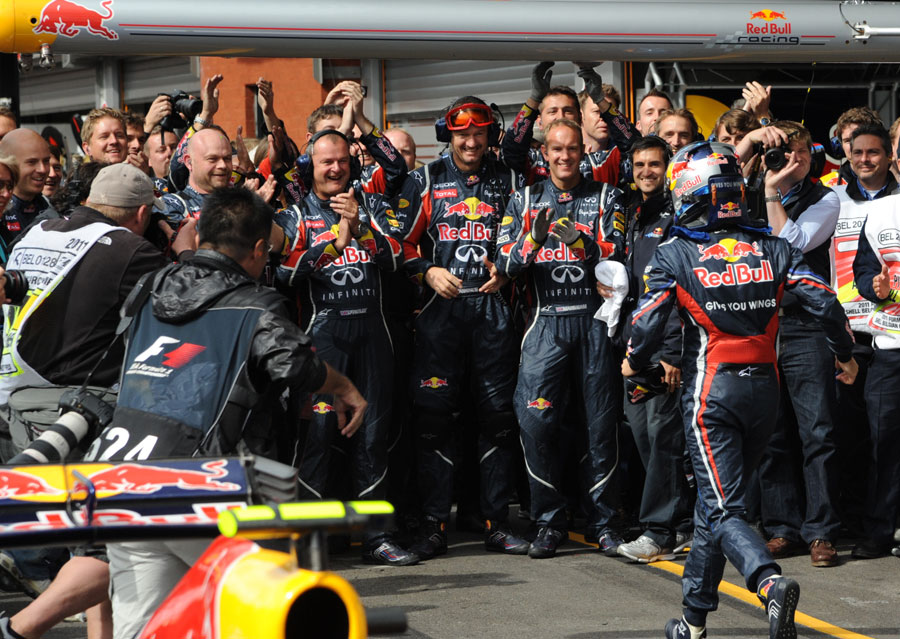 Sebastian Vettel celebrates victory with his Red Bull team