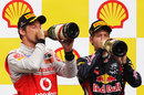 Sebastian Vettel and Jenson Button enjoy a drink