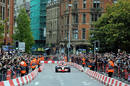Jenson Button demonstrates a McLaren on the streets of Manchester
