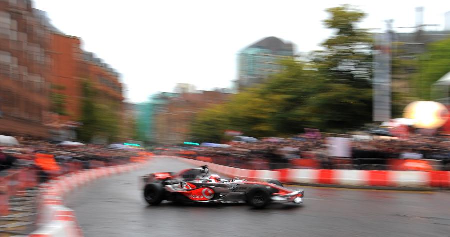 Jenson Button at speed during a demonstration run in Manchester