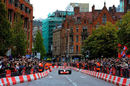 Jenson Button takes a McLaren on a demonstration run in Manchester