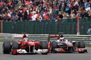 Jenson Button eases level with Fernando Alonso along the Kemmel straight