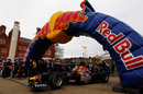 Mark Webber drives his Red Bull F1 car through the city streets of Cardiff