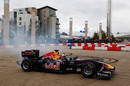 Mark Webber wows the crowd by performing donuts through the city streets of Cardiff at the Red Bull Speed Jam event
