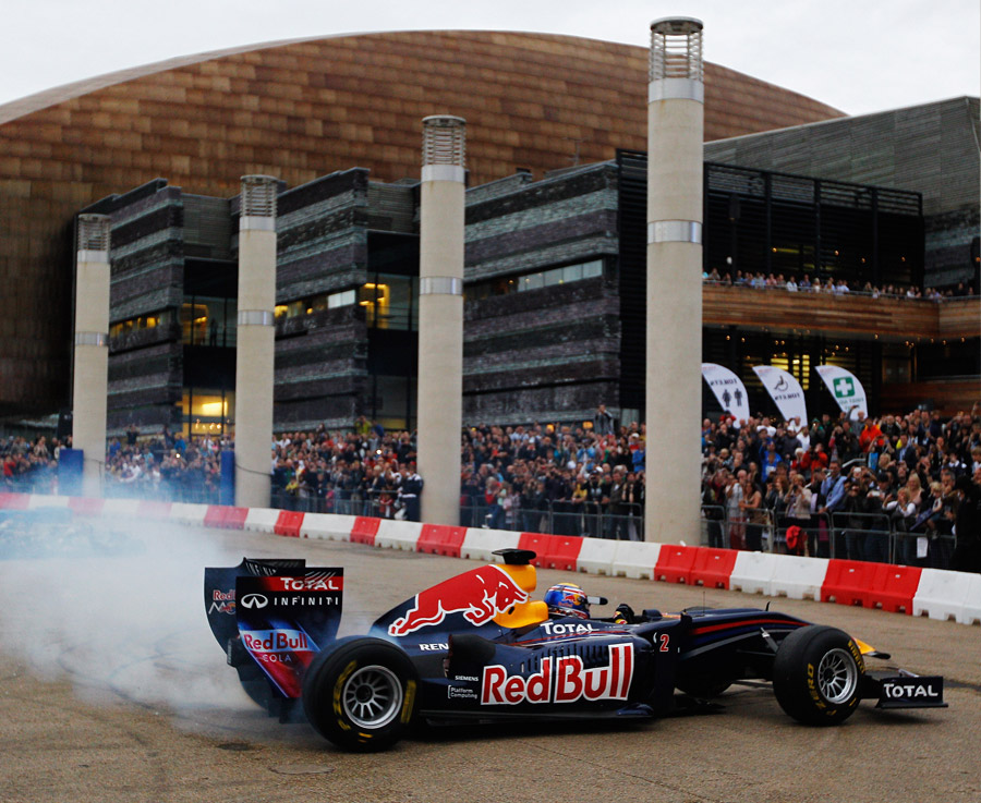 Mark Webber performs donuts through the city streets of Cardiff at the Red Bull Speed Jam event