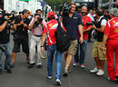 Felipe Massa catches photographers' attention in the paddock