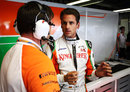 Adrian Sutil talks to his engineer during free practice