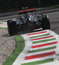 Jenson Button uses every inch of the circuit on the exit of the second chicane