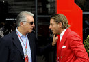 Piero Ferrari and Lapo Elkann talk in the paddock
