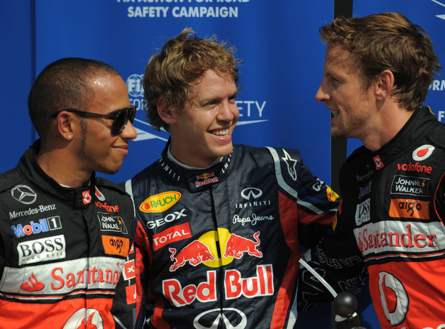 Sebastian Vettel enjoys his pole position with Lewis Hamilton and Jenson Button