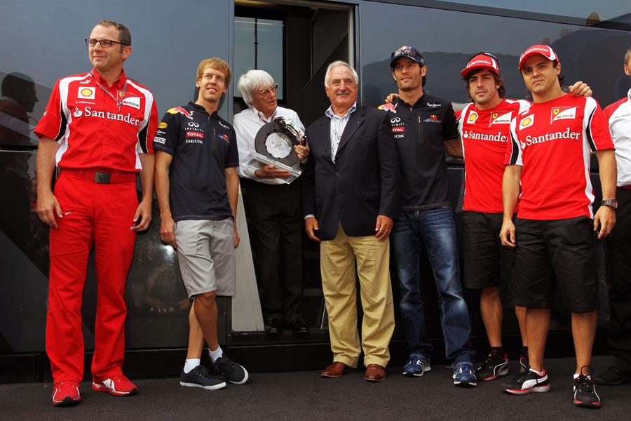 Bernie Ecclestone is presented with a Brembo brake on Sunday morning