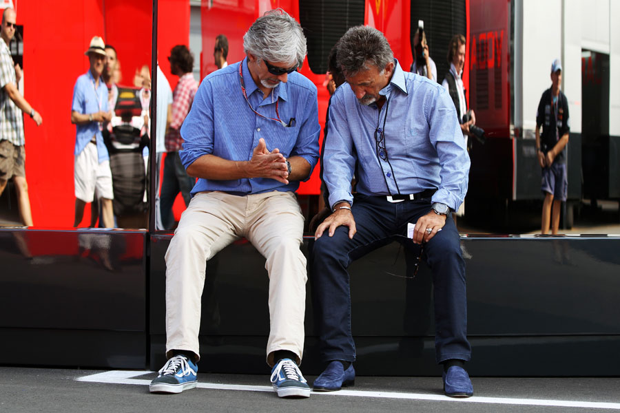 Damon Hill and Eddie Jordan deep in discussion in the paddock