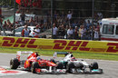 Michael Schumacher battles with Fernando Alonso