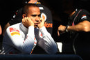 Lewis Hamilton watches on from the pit wall