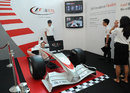 A member of the public tries an F1 simulator at the UBS headquarters in Singapore