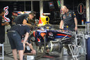Red Bull mechanics work on Sebastian Vettel's RB7