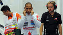 Lewis Hamilton waits in the McLaren garage as his car is fired up