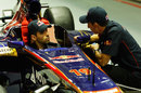 Jaime Alguersuari and Sebastien Buemi chat in the Toro Rosso garage