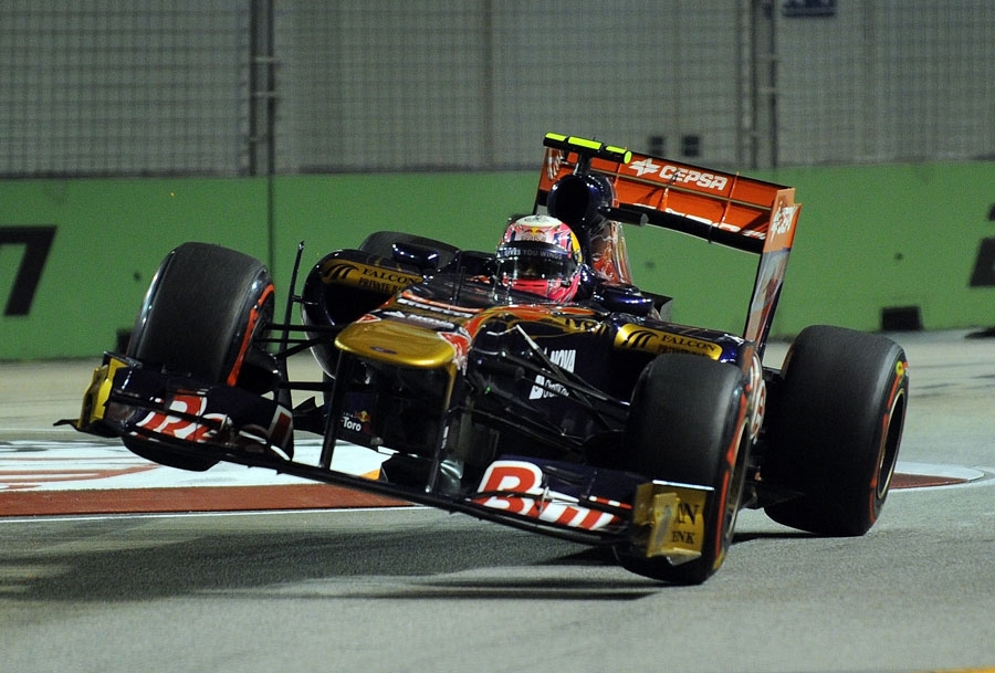 Jaime Alguersuari launches his Toro Rosso over the kerbs at turn 10