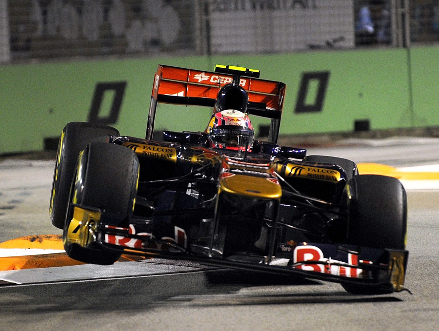 Jaime Alguersuari lands his Toro Rosso after clobbering the kerbs
