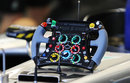 A Mercedes steering wheel sits on the front of the car