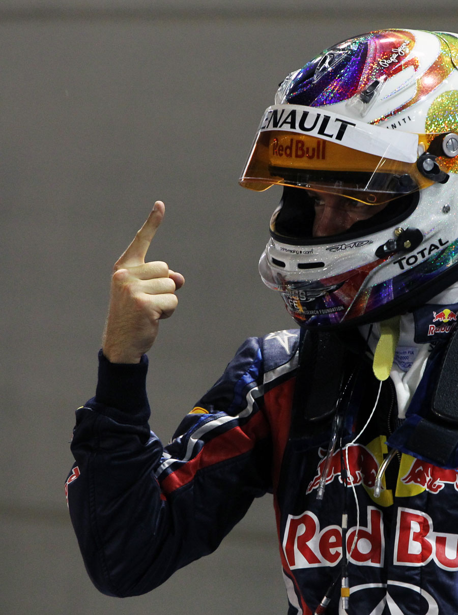 Sebastian Vettel celebrates taking pole position in his customary style