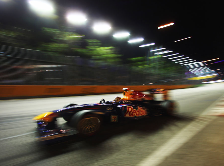 Sebastian Vettel at speed under the lights