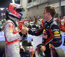 Jenson Button congratulates Sebastian Vettel after the race