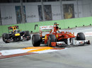 Fernando Alonso leads Mark Webber through the turn 10 chicane