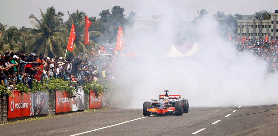 Lewis Hamilton performs on the Bangalore-Mysore highway during a promotional event 
