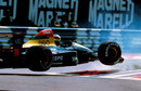Aguri Suzuki launches his Larrousse backwards over the first chicane