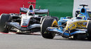 Kimi Raikkonen attacks Giancarlo Fisichella on the penultimate lap