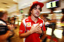 Fernando Alonso sneaks out of the autograph signing session