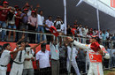 Lewis Hamilton throws McLaren goodies to fans in Bangalore