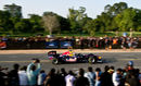 Daniel Ricciardo drives down the Rajpath in the Red Bull showcar