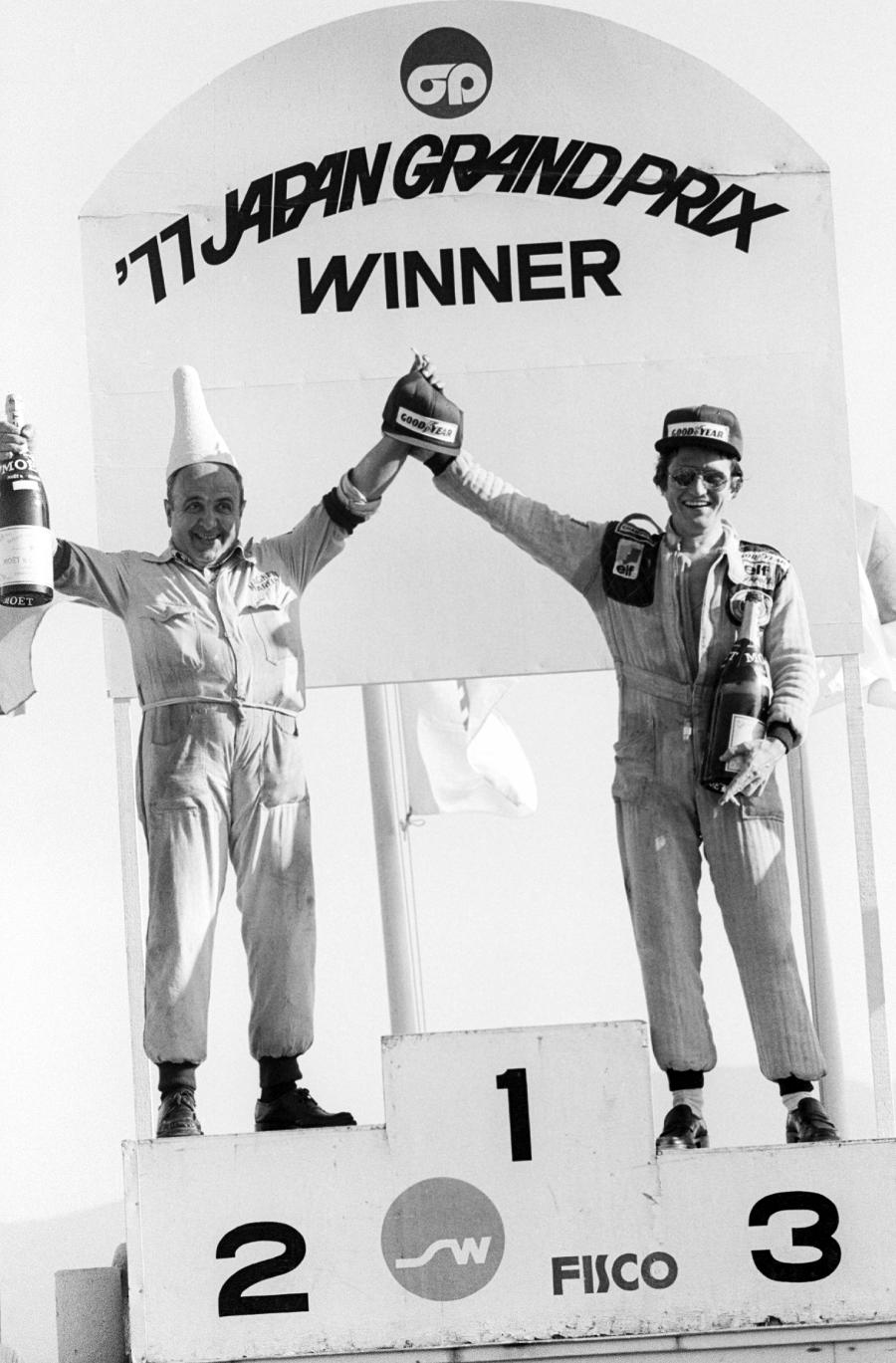 Patrick Depailler was the only driver to take to the podium and celebrates with the Marelli Magneti representative