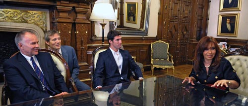 Argentina's president Cristina Fernandez de Kirchner meets with Jose Maria Lopez and US F1's sporting director Peter Windsor