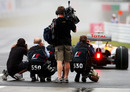 F1 photographers shoot Romain Grosjean leaving the pits